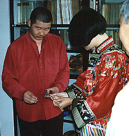 Buddhist Wedding Ceremony: Trying to light the incense