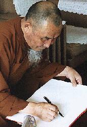 Buddhist Wedding Ceremony: Monk signing weddingbook
